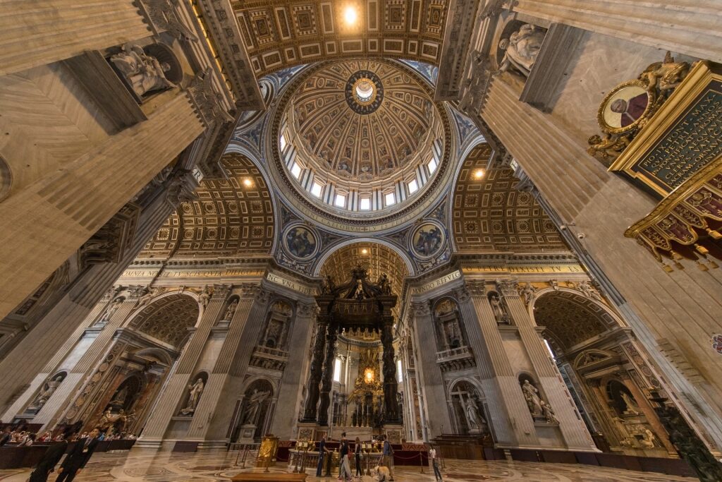 Upward view of the grand interior dome inside St. Peter’s Basilica, Vatican City