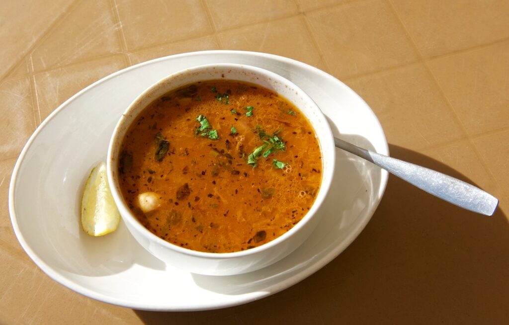 Bowl of Maltese aljotta garnished with parsley