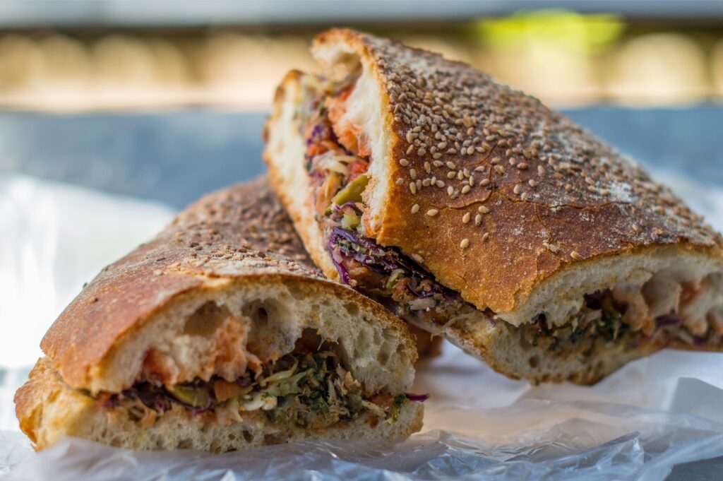 Traditional Maltese ftira bread filled with tuna, olives, and tomatoes