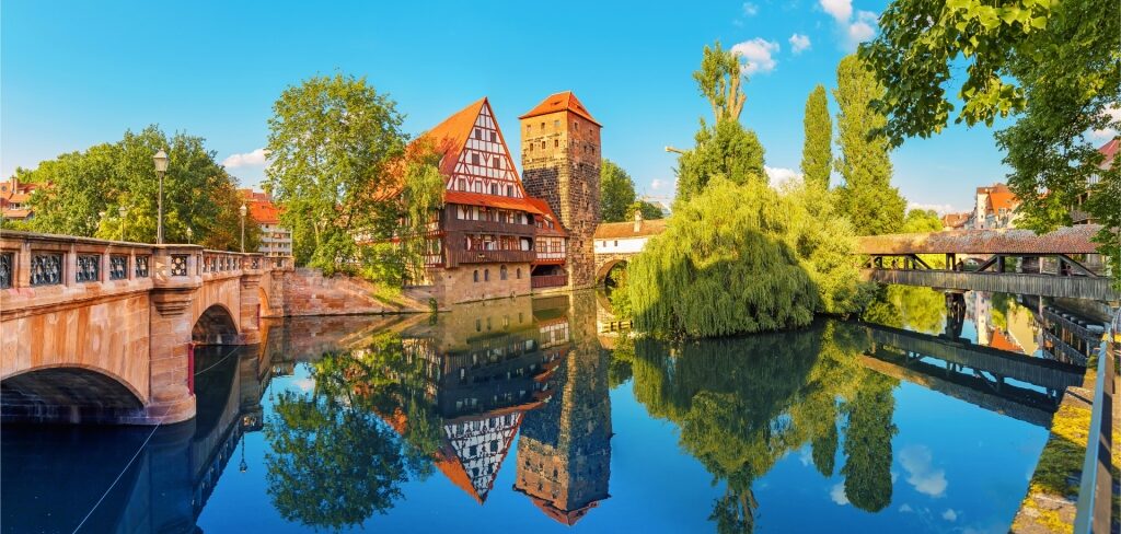 Picturesque view of historic timber-framed homes by the Pegnitz River