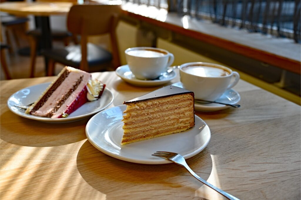 Slices of traditional German cakes served on plates at a café