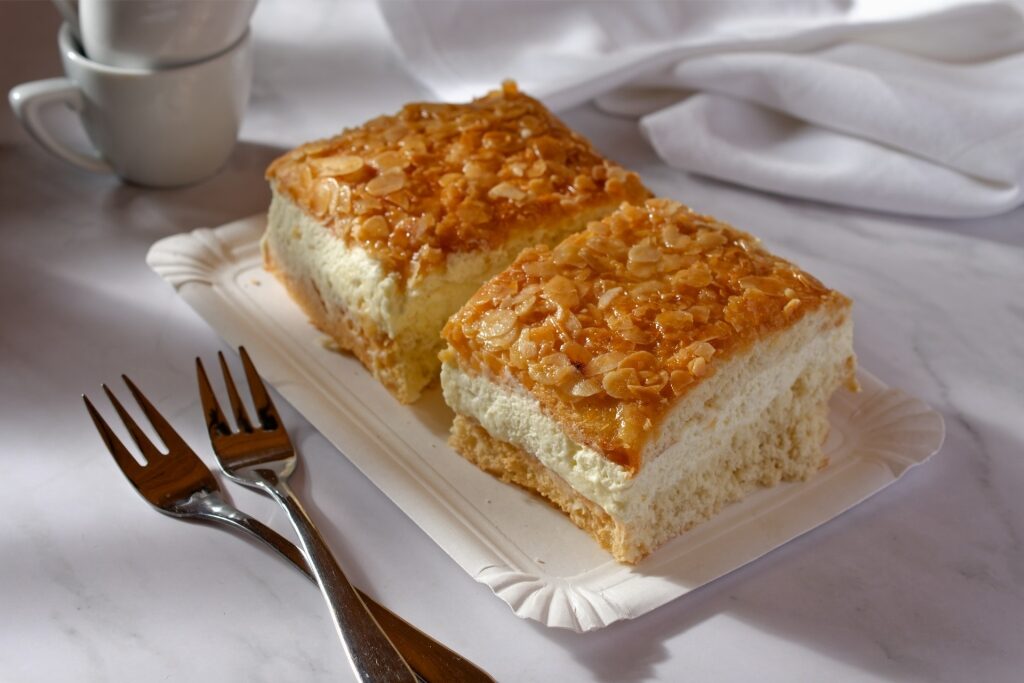 German Bienenstich pastry with golden caramelized almonds and vanilla cream