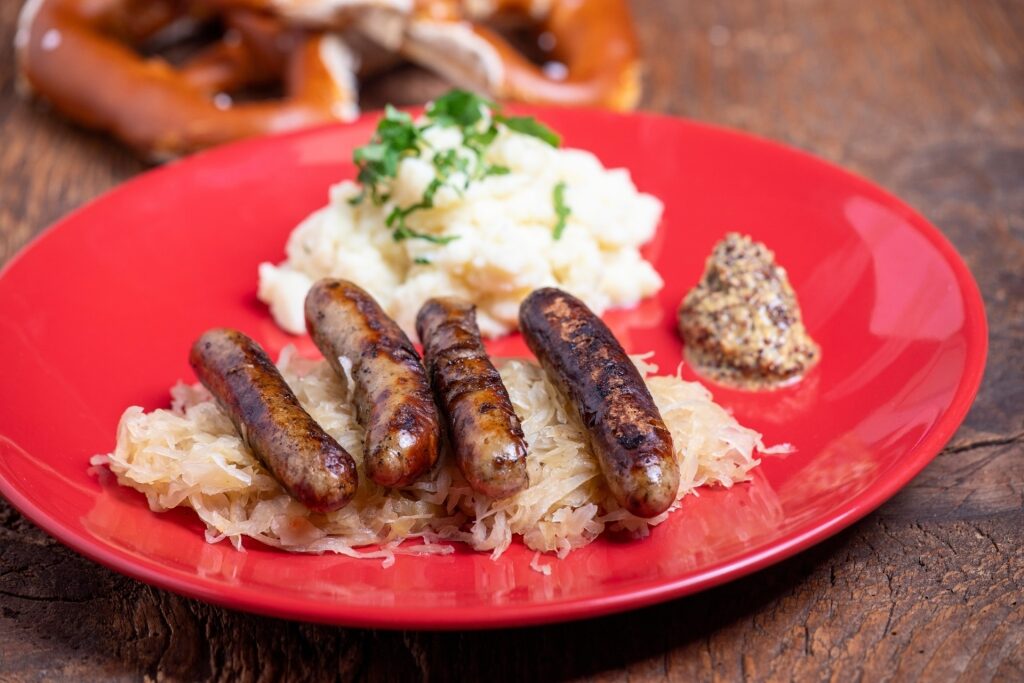 Bratwurst served with sauerkraut on a plate
