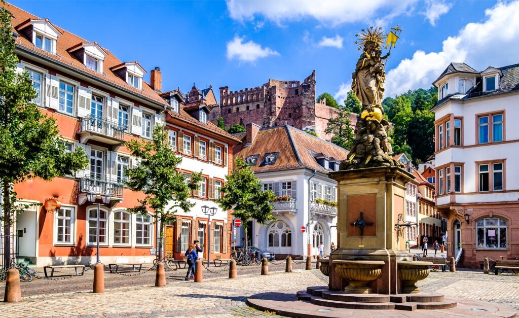 Historic fountain surrounded by charming buildings in Heidelberg’s Old Town square