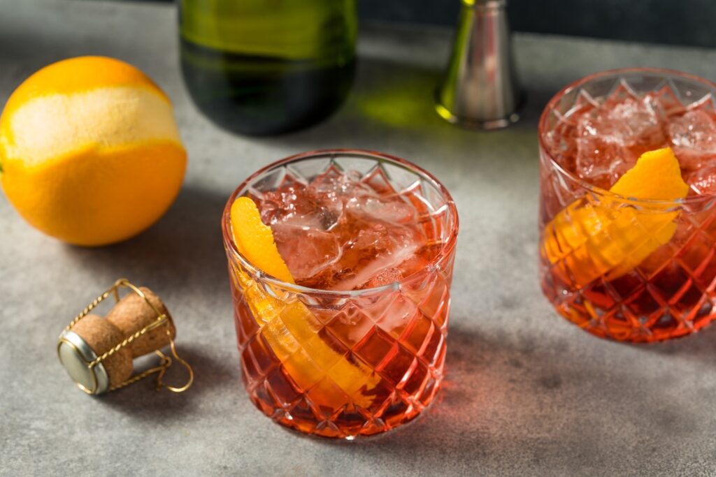 Classic Italian beverage Negroni cocktail with orange garnish