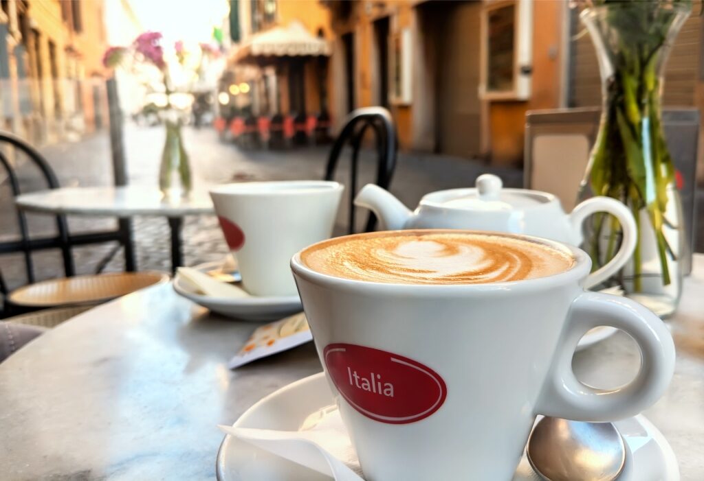 Morning cappuccino along a historic street in Rome