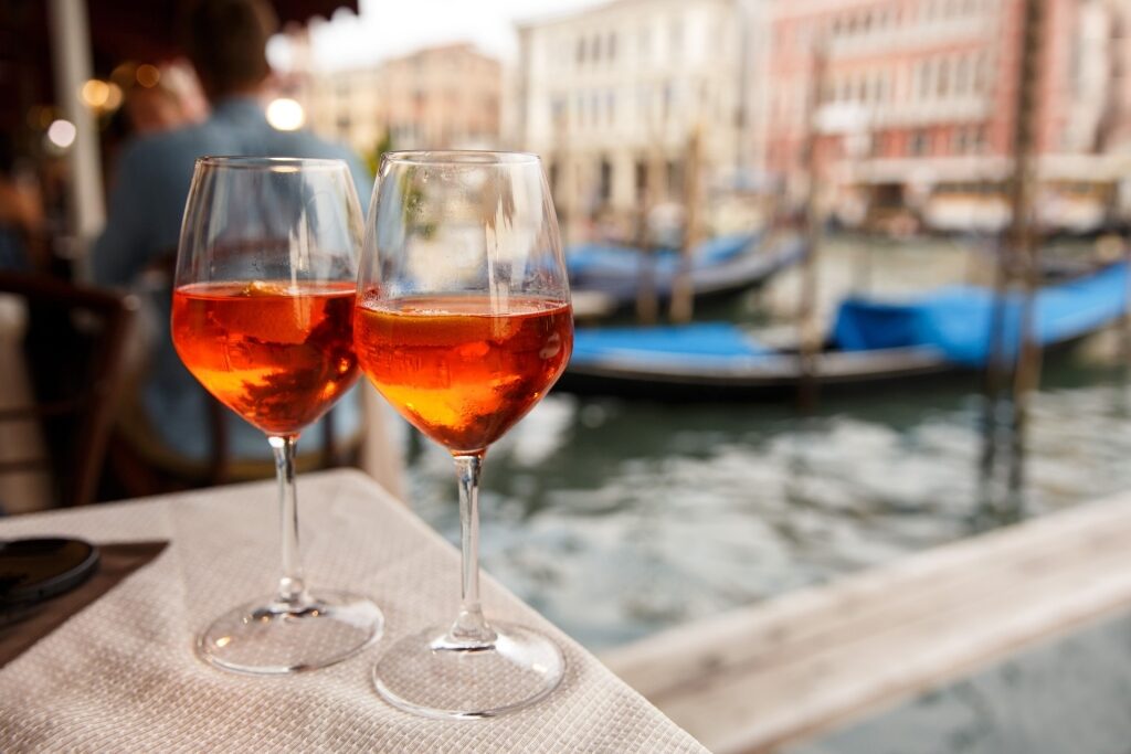 Two glasses of Aperol Spritz at a Venice café