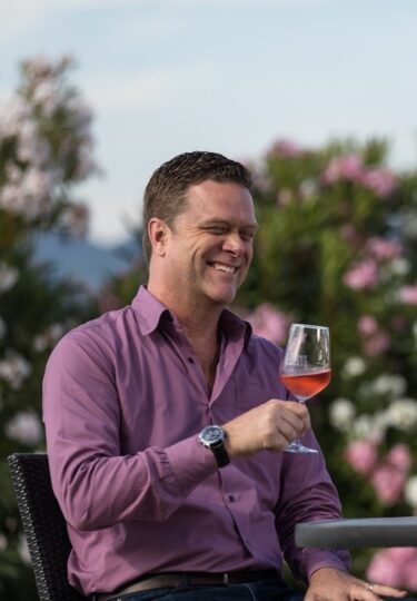 Tourist couple savoring wines at an Italian winery