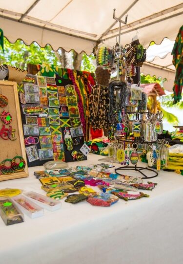 Table with colorful handcrafted Jamaica souvenirs and keepsakes