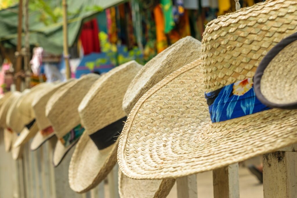 Straw hats displayed as Jamaica souvenirs at a local market