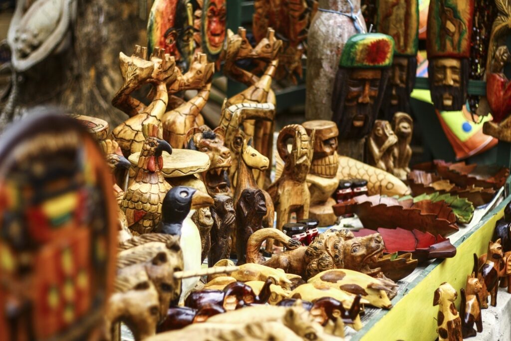 Assorted wooden carvings and handcrafted souvenirs arranged for purchase