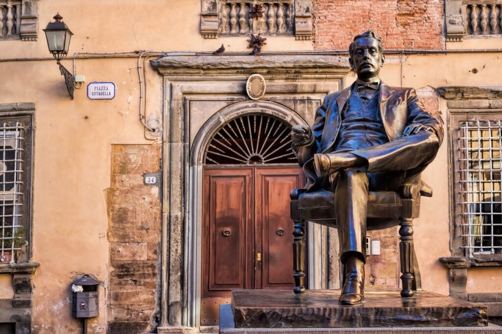 Statue of composer Giacomo Puccini outside the Giacomo Puccini Museum in Lucca, Italy
