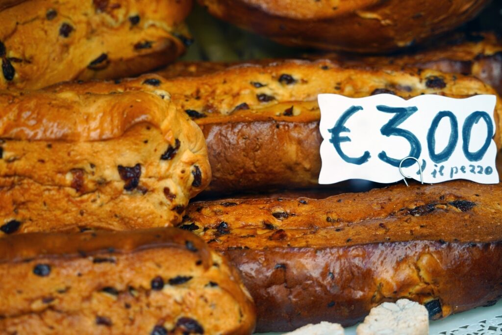 Traditional Buccellato di Lucca cake with raisins and nuts from Lucca, Italy