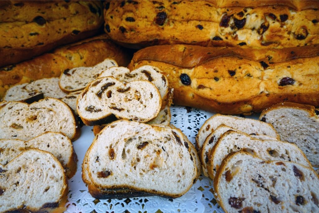 Traditional Buccellato di Lucca cake with raisins and nuts from Tuscany, Italy