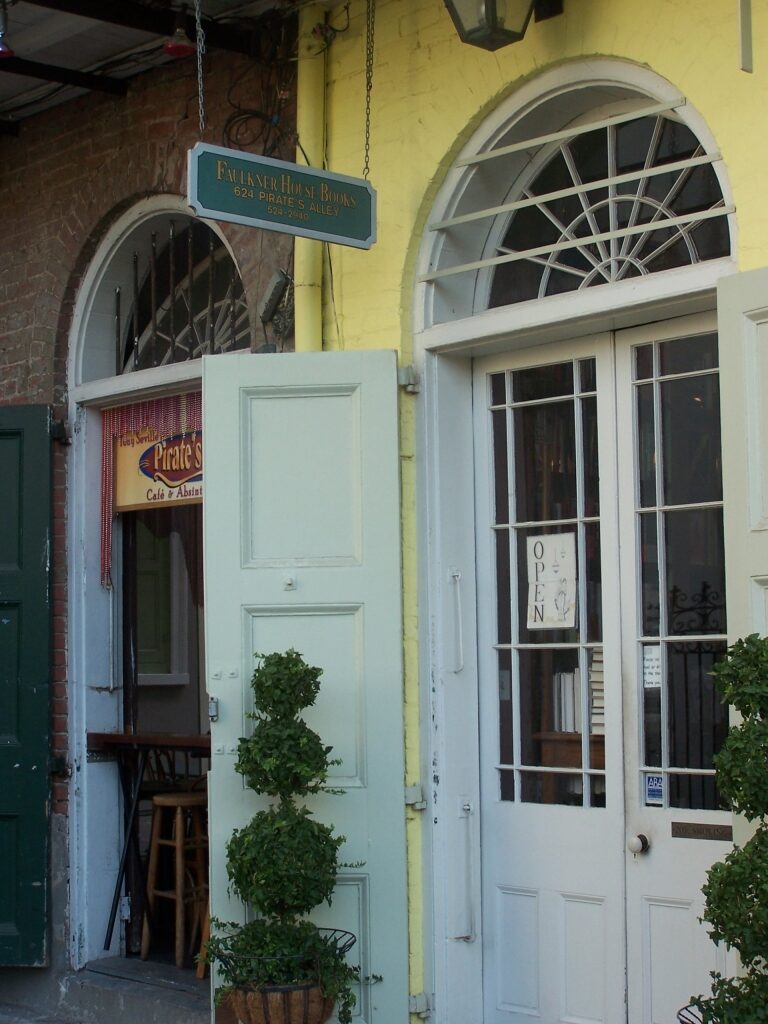 Entrance view of Faulkner House Books with signage in New Orleans