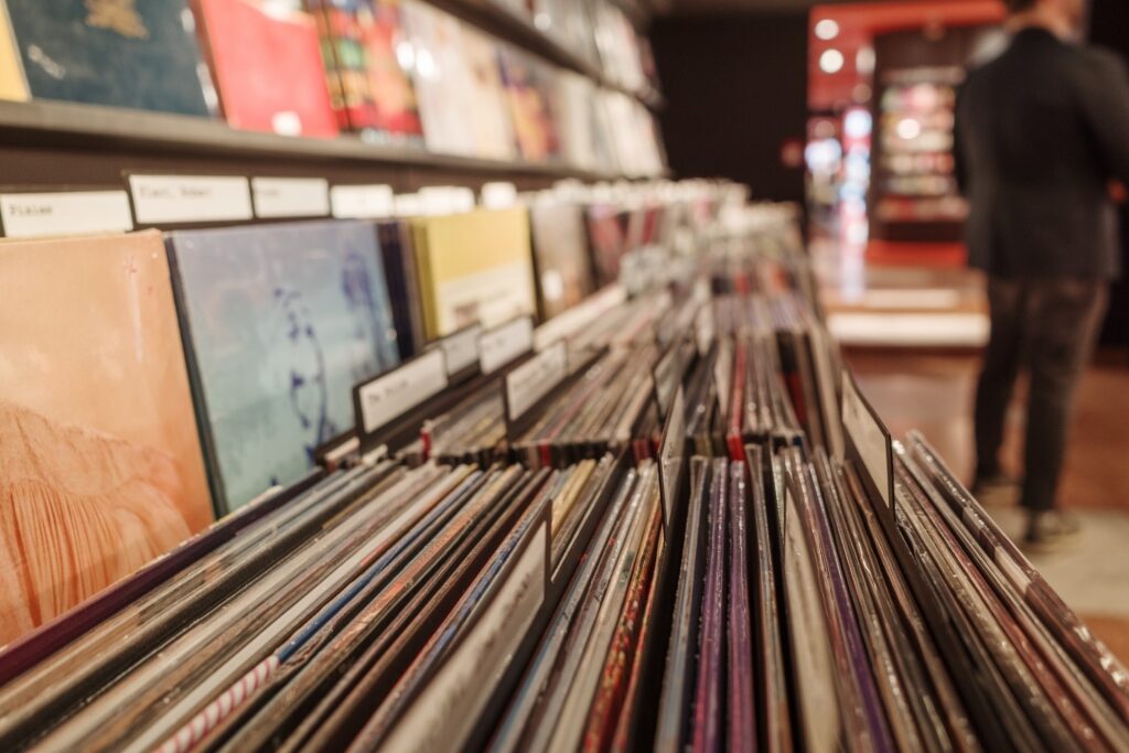 Close-up of neatly arranged vinyl records in a retro music store