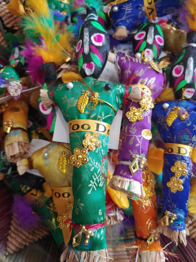 Colorful voodoo dolls displayed for sale at a New Orleans market