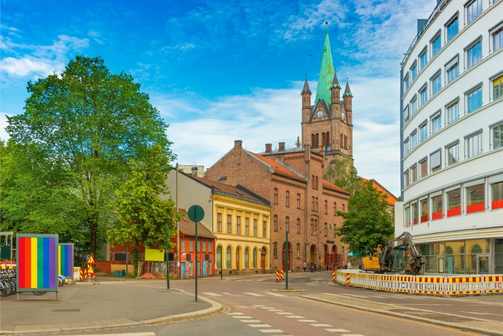 View of Oslo’s Grønland Church and Pride decorations along the street
