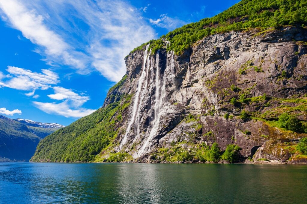 Scenic view of Seven Sisters Waterfall cascading in Norway in the summer