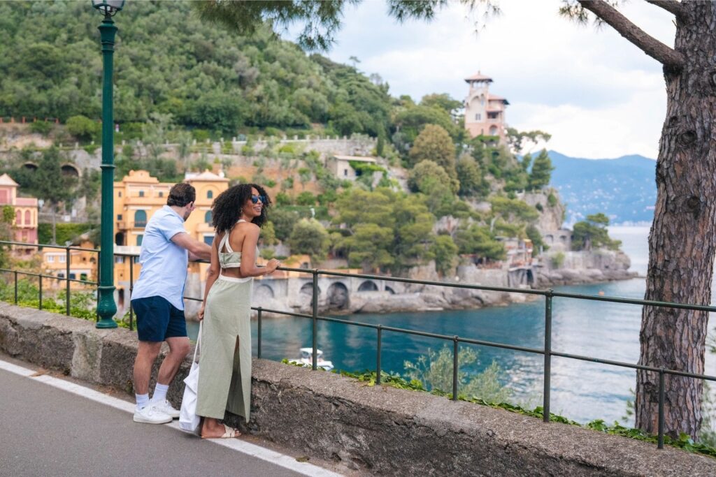 Visitors enjoying scenic coastal views in Portofino overlooking the harbor