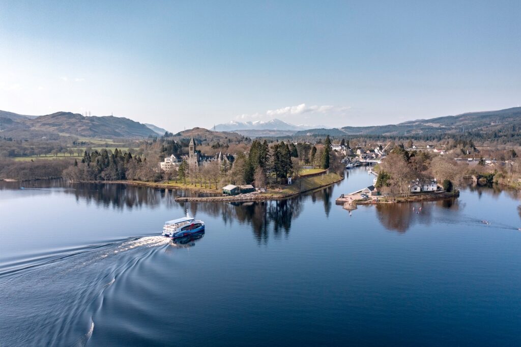 Scenic boat ride approaching Fort Augustus with Highlands landscape