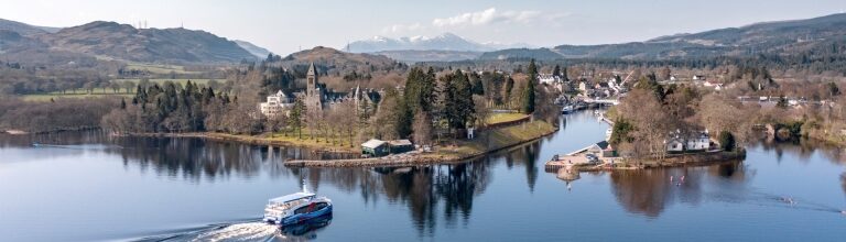 Scenic boat ride approaching Fort Augustus with Highlands landscape