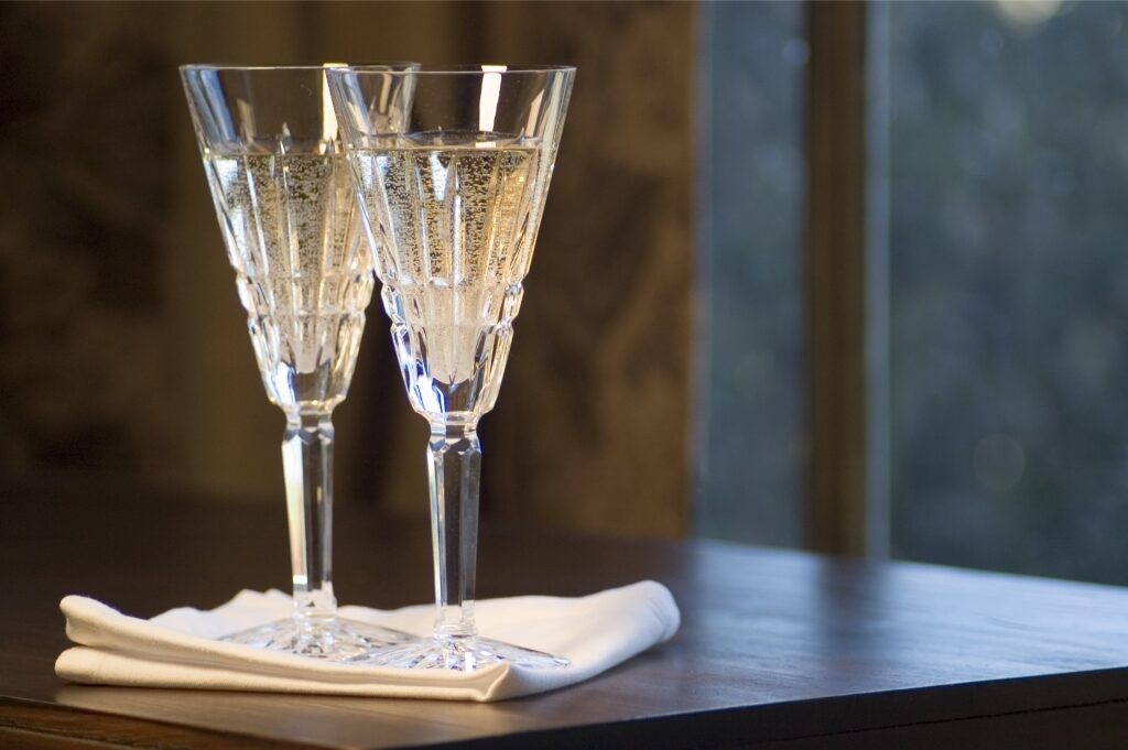 Pair of elegant Waterford lead crystal champagne glasses on a table