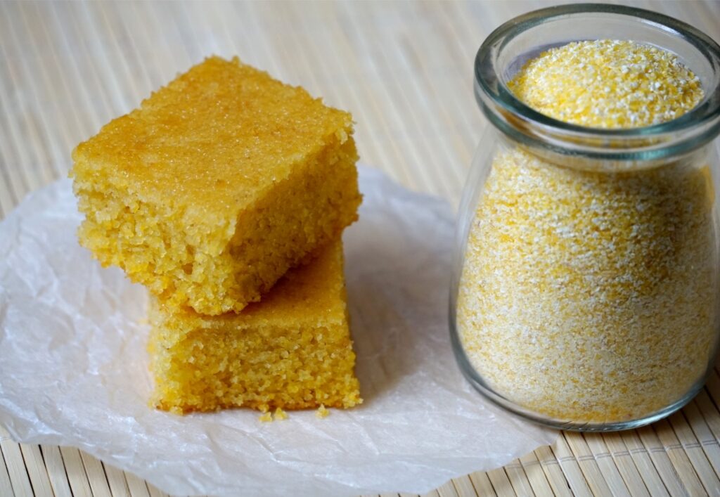 Two pieces of freshly baked cornmeal cake