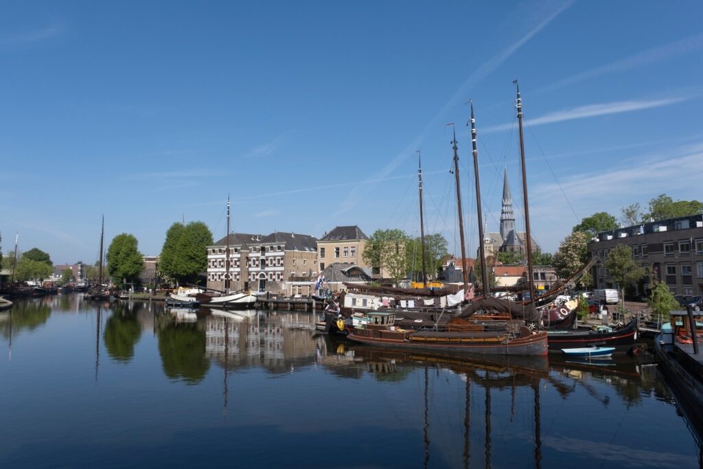 Scenic view of Gouda’s Museum Harbor with traditional vessels on the canal