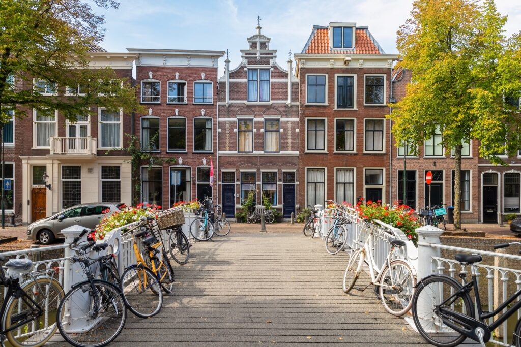 Traditional Dutch canal houses in Gouda, Netherlands with bikes parked outside