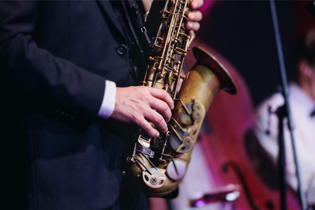 Close-up of a saxophonist playing on stage