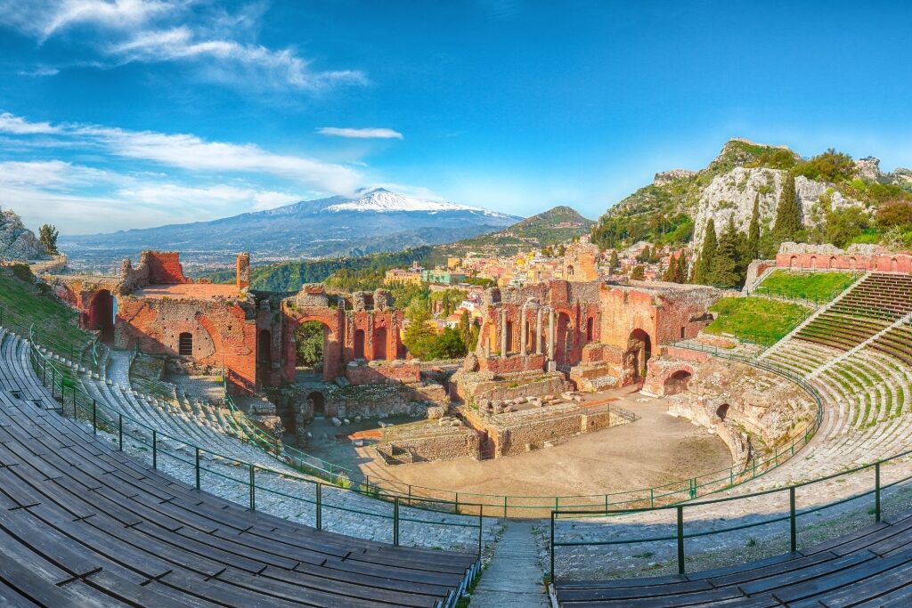 Scenic view of Sicily’s Greek Theatre of Taormina with Etna in the distance