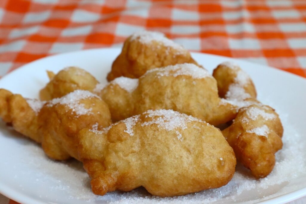 Plate of Sfinci di San Martino, classic fried Sicilian pastries