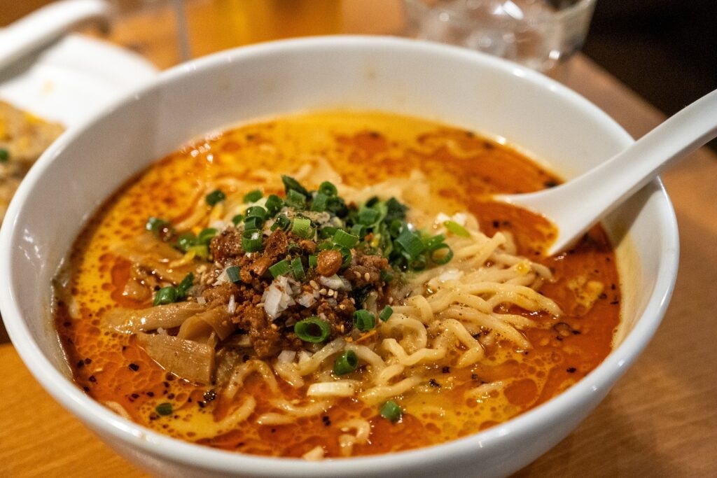 Bowl of spicy Japanese tantanmen ramen topped with chili oil