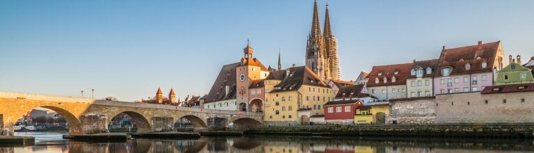 Regensburg cityscape with Stone Bridge over the Danube river and St. Peter Cathedral