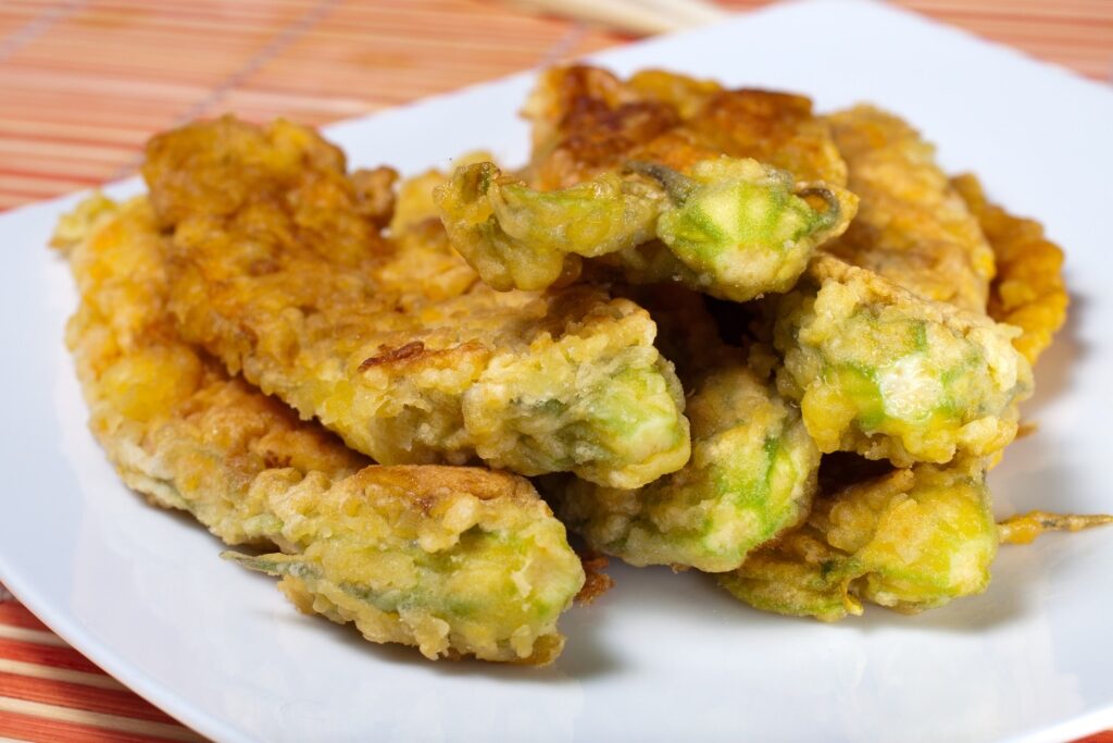 Fried zucchini blossoms known as Fiori di Zucca on a plate