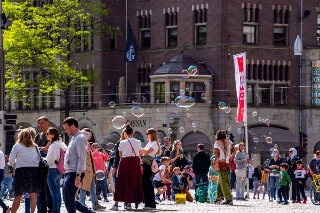 Busy Amsterdam scene with a crowd of visitors