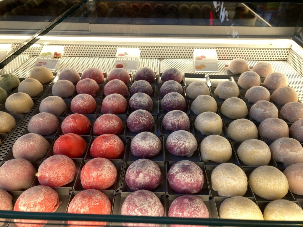 Colorful mochi ice cream varieties for sale inside the Markthal, Rotterdam