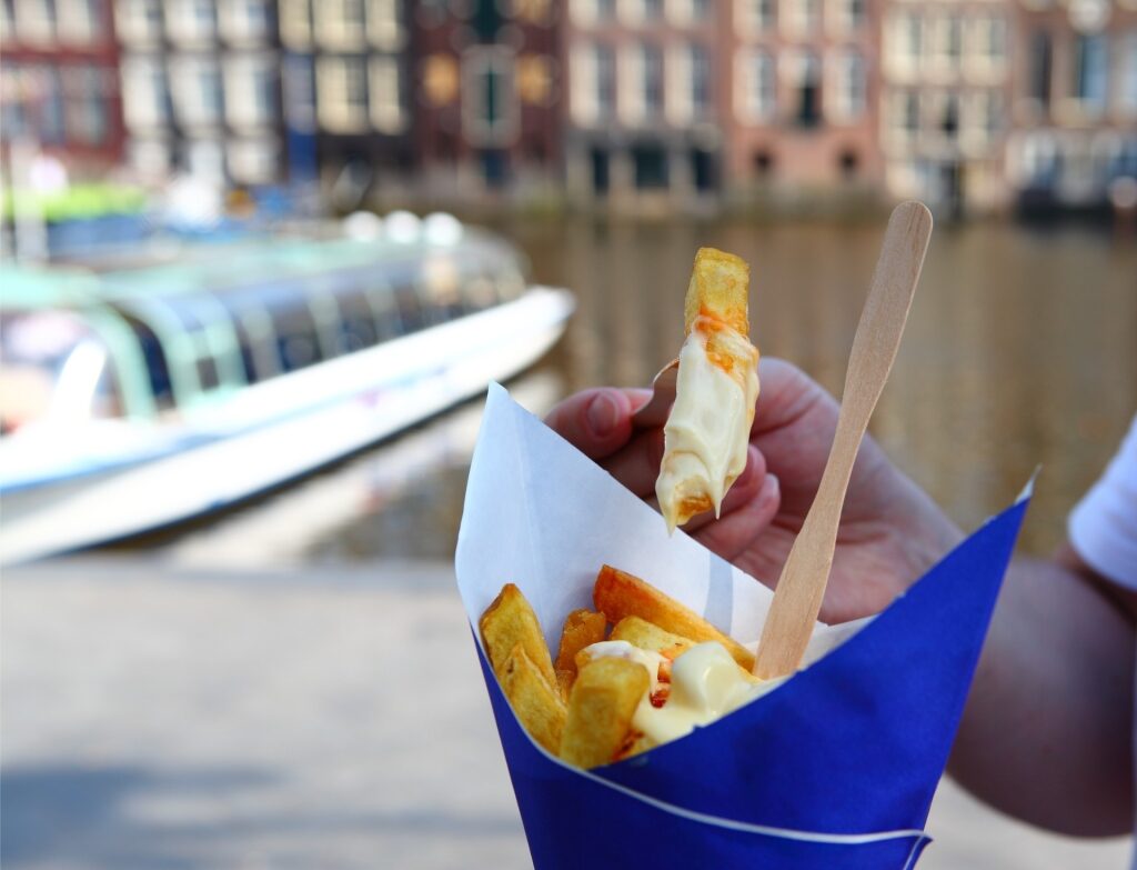 Cone of crispy patat fries in Amsterdam