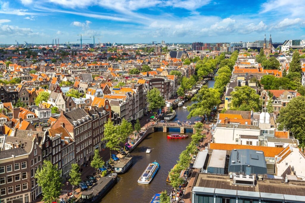 Aerial view of Amsterdam on a summer day with canals and historic houses