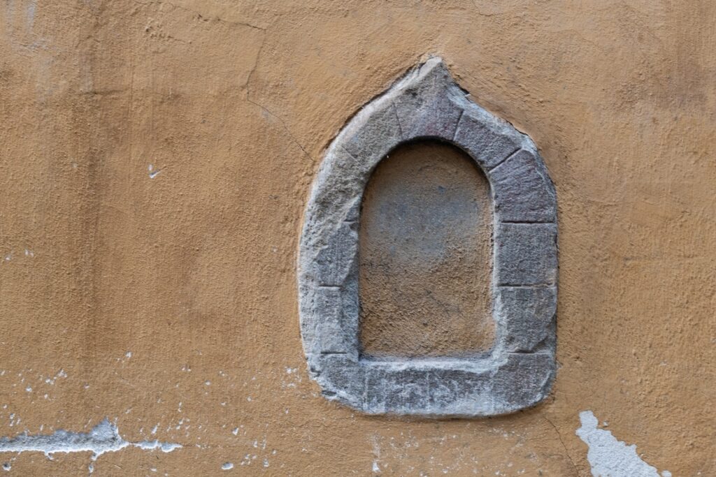 Historic closed wine window, or buchetta del vino, in Florence