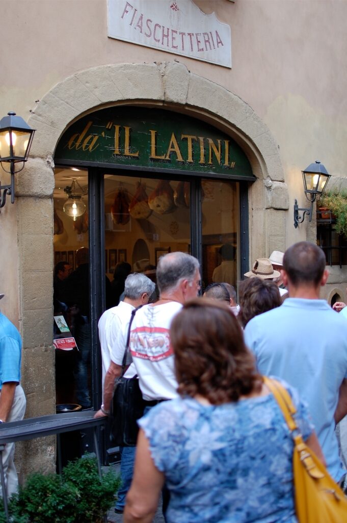 Queue of customers waiting outside Il Latini in Florence Italy