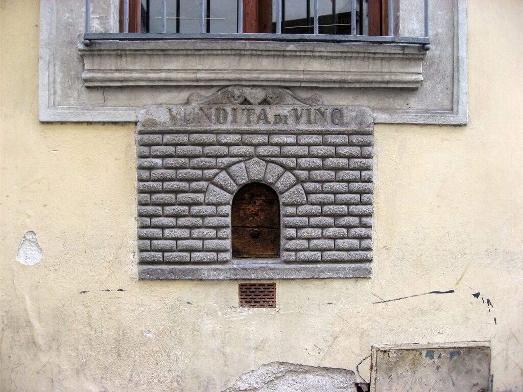 Historic wine window in Florence used for serving wine to passersb