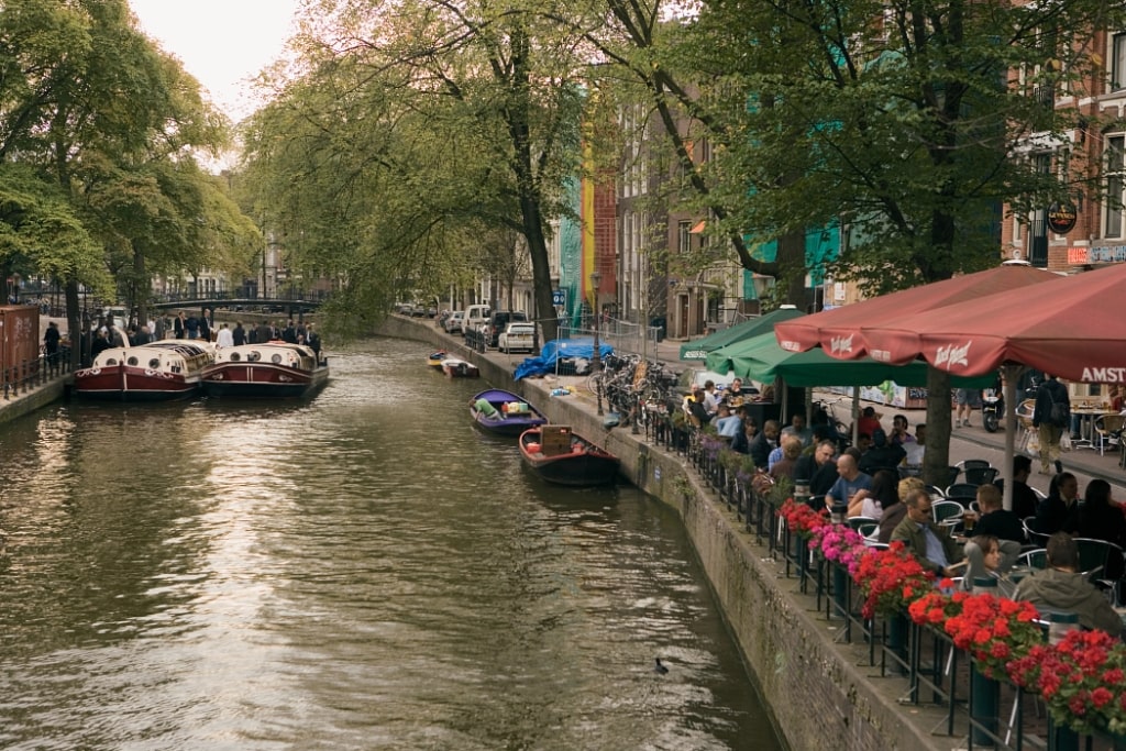 Outdoor cafe terrace along the beautiful Leliegracht canal in Amsterdam, Netherlands