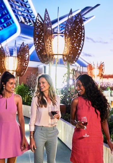 Guests enjoy an elegant evening, surrounded by dining, entertainment and ocean views.