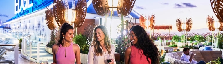Guests enjoy an elegant evening, surrounded by dining, entertainment and ocean views.