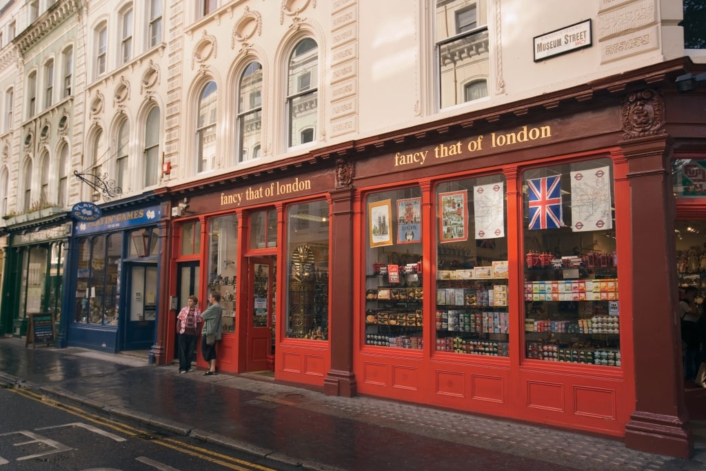 Quaint brick London museum street shops showcase traditional British storefront architecture.
