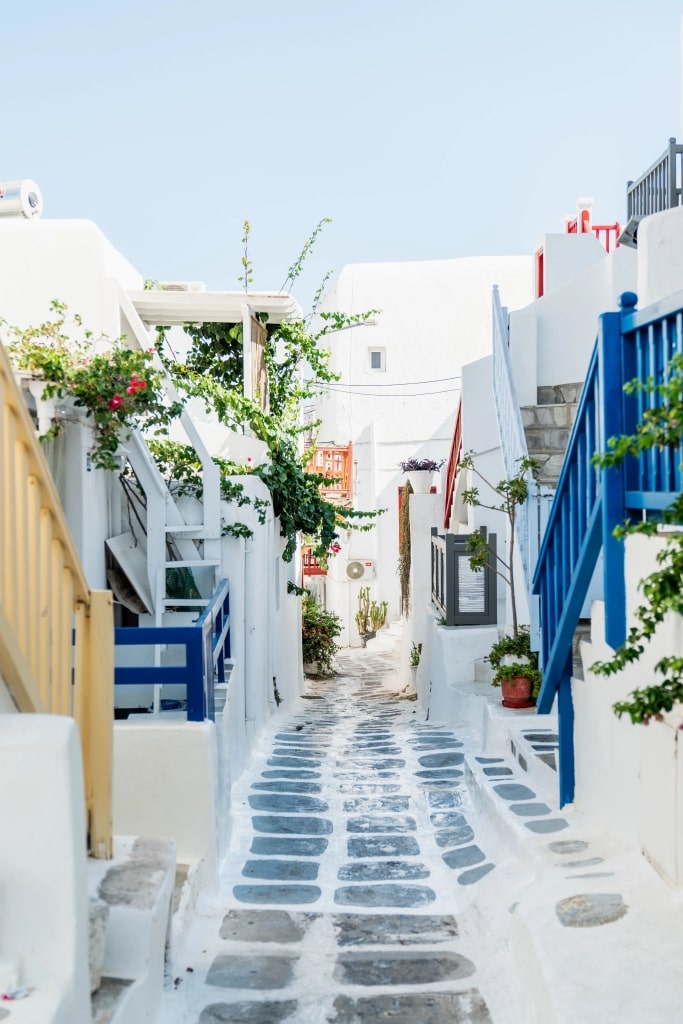 A narrow pedestrian street in Mykonos, Greece.