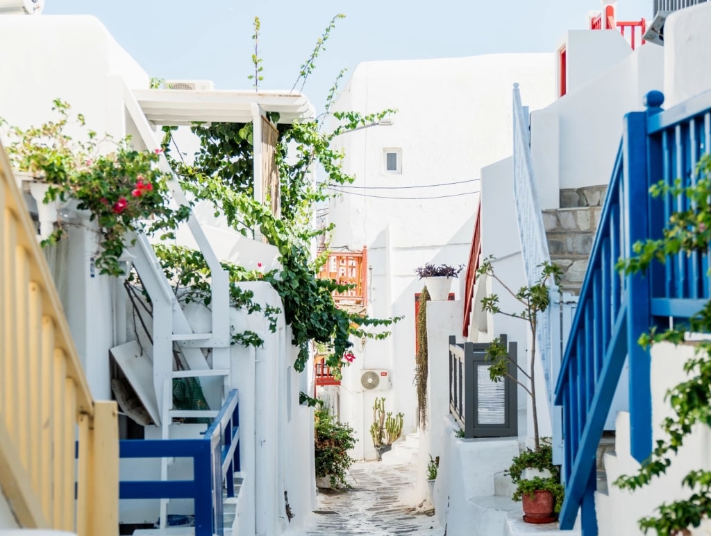A narrow pedestrian street in Mykonos, Greece.