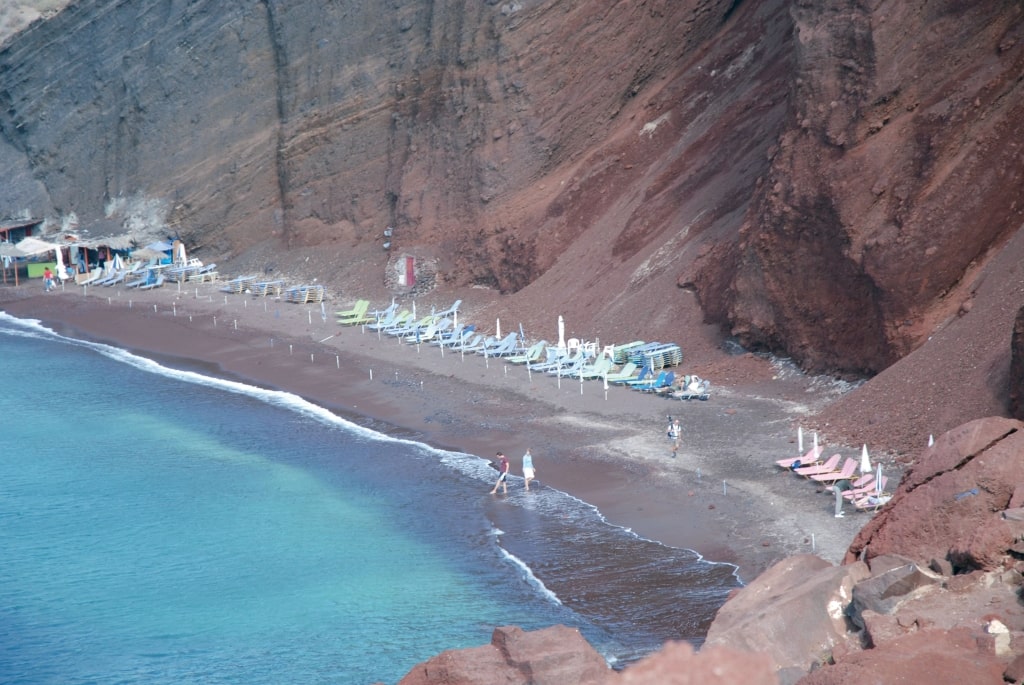 The Red Beach, where the red volcanic cliffs meet the turquoise Aegean Sea.